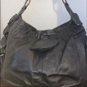 Vince Camuto black handbag with rose detail on sides